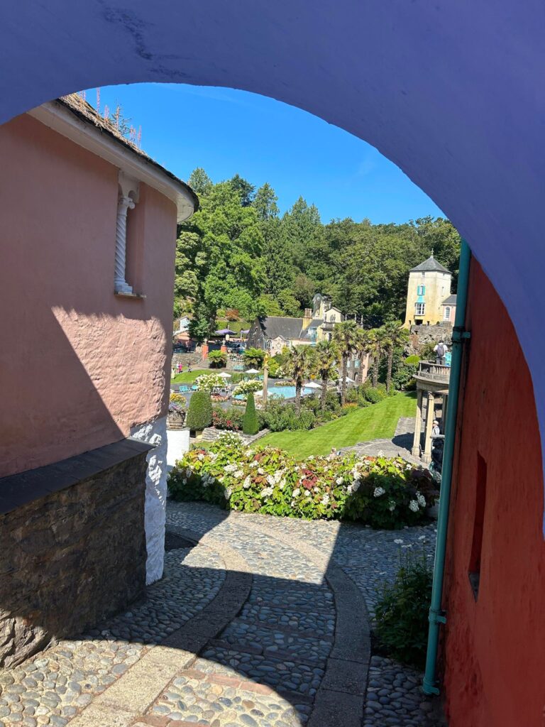 Port meirion view through an archway , very colourful image